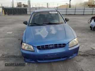 2001 Hyundai Accent GL with VIN KMHCG45C91U195735, listed as a Copart auction lot 80950554 with 164,176 mi miles and Salvage title. Bid and sale history available at DreamBid. Image 5.