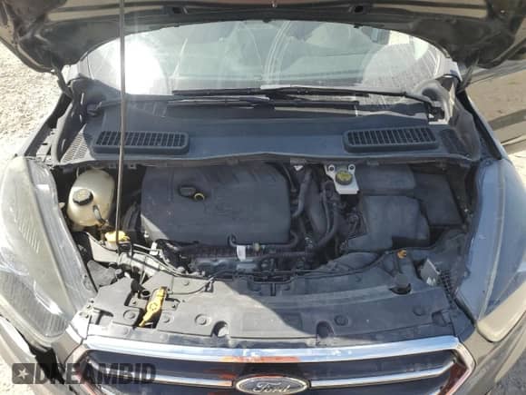 2018 Ford Escape SE z VIN 1FMCU9GD6JUD48647, wystawiony jako Copart lot #70868345 z przebiegiem 102 072 mil mil oraz Szkoda całkowita • Salvage title. Historia ofert i sprzedaży dostępna na DreamBid. Obrazek 12.