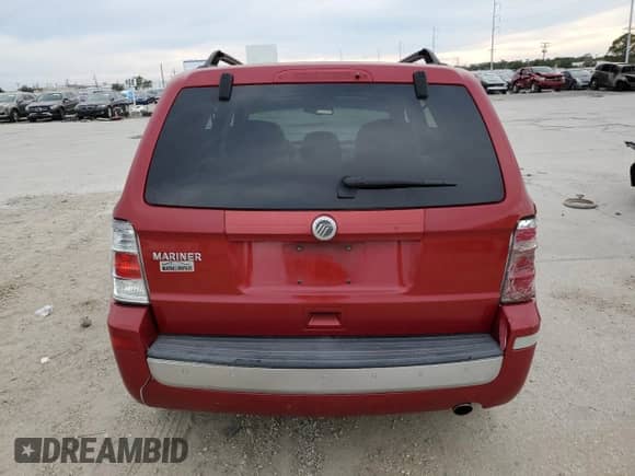 2011 Mercury Mariner z VIN 4M2CN8B77BKJ04820, wystawiony jako Copart lot #77322383 z przebiegiem Nie podano mil oraz Szkoda całkowita • Salvage title. Historia ofert i sprzedaży dostępna na DreamBid. Obrazek 6.