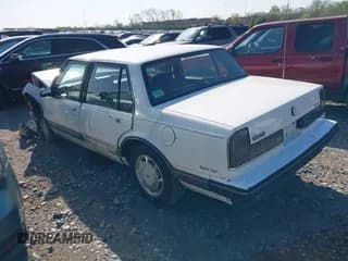 ✅ 1990 Oldsmobile Delta • VIN: 1G3HN54C1L1808457 • Лот: 41978123. Опубликован ранее на IAAI с пробегом 146 383 миль. Бесплатный доступ к архиву аукционных продаж из США и подробный отчёт об истории автомобиля на DreamBid. Изображение 3.