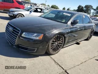 ✅ 2016 Audi A8 3.0T • VIN: WAU34AFD0GN005128 • Lot: 84060575. Wystawiony na Copart z przebiegiem 167 790 mil. Bezpłatny archiwum sprzedaży aukcyjnych z USA i szczegółowy raport historii pojazdu na DreamBid. Zdjęcie 1.