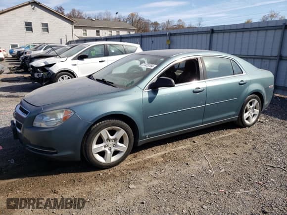 ✅ 2009 Chevrolet Malibu 1LS • VIN: 1G1ZG57B39F233414 • Lot: 77423764. Listed on Copart with 164,099 mi. Free auction sales archive from the USA and detailed vehicle history report at DreamBid. Image 1.