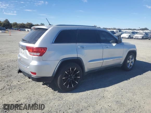 ✅ 2011 Jeep Grand Cherokee Overland • VIN: 1J4RR6GT7BC604866 • Lot: 91003765. Listed on Copart with 128,314 mi. Free auction sales archive from the USA and detailed vehicle history report at DreamBid. Image 3.