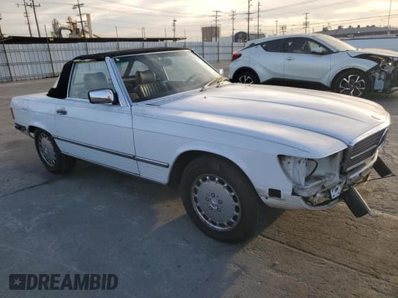 ✅ 1989 Mercedes-Benz 560 SL • VIN: WDBBA48D7KA100290 • Lot: 85049924. Listed on Copart with 88,919 mi. Free auction sales archive from the USA and detailed vehicle history report at DreamBid. Image 4.