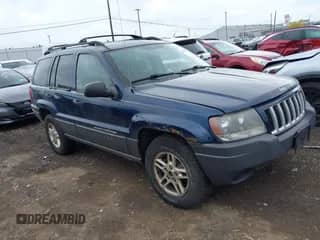 2004 Jeep Grand Cherokee Laredo with VIN 1J4GW48S74C309540, listed as a IAAI auction lot 43305015 with 153,188 mi miles and . Bid and sale history available at DreamBid. Image 1.