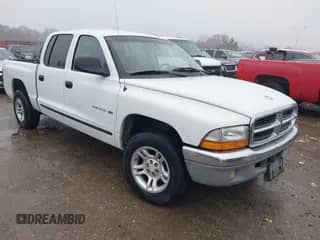 2002 Dodge Dakota SLT z VIN 1B7HL48N72S505915, wystawiony jako IAAI lot #41451568 z przebiegiem 220 716 mil mil oraz . Historia ofert i sprzedaży dostępna na DreamBid. Obrazek 1.