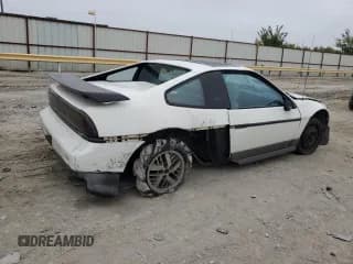 ✅ 1986 Pontiac Fiero • VIN: 1G2PG9796GP283609 • Lot: 79048574. Wystawiony na Copart z przebiegiem 211 447 mil. Bezpłatny archiwum sprzedaży aukcyjnych z USA i szczegółowy raport historii pojazdu na DreamBid. Zdjęcie 3.
