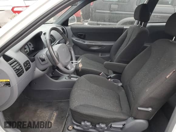 2003 Hyundai Accent GL with VIN KMHCG35C53U258469, listed as a Copart auction lot 82977294 with 99,136 mi miles and Clean title. Bid and sale history available at DreamBid. Image 7.