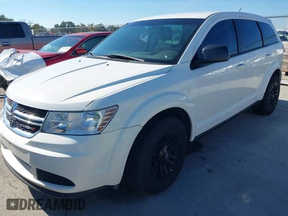 2015 Dodge Journey American Value z VIN 3C4PDCAB0FT540285, wystawiony jako IAAI lot #43610721 z przebiegiem 208 916 mil mil oraz . Historia ofert i sprzedaży dostępna na DreamBid. Obrazek 2.