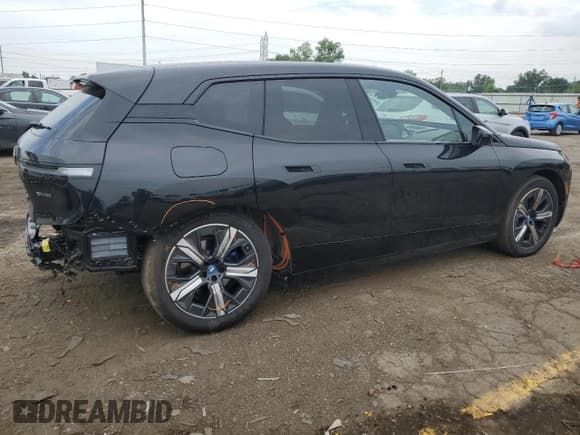 ✅ 2024 BMW iX xDrive50 • VIN: WB523CF01RCN55992 • Лот: 59352604. Опубликован ранее на Copart с пробегом 8 415 миль. Бесплатный доступ к архиву аукционных продаж из США и подробный отчёт об истории автомобиля на DreamBid. Изображение 3.