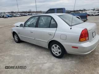 2004 Hyundai Accent GL with VIN KMHCG45C94U564176, listed as a Copart auction lot 82963944 with 454,400 mi miles and Salvage title. Bid and sale history available at DreamBid. Image 2.