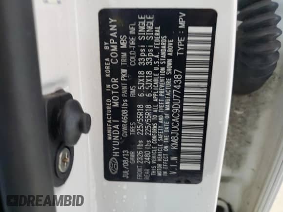 2013 Hyundai Tucson GLS z VIN KM8JUCAC9DU774387, wystawiony jako Copart lot #67417185 z przebiegiem 108 385 mil mil oraz Szkoda całkowita • Salvage title. Historia ofert i sprzedaży dostępna na DreamBid. Obrazek 13.