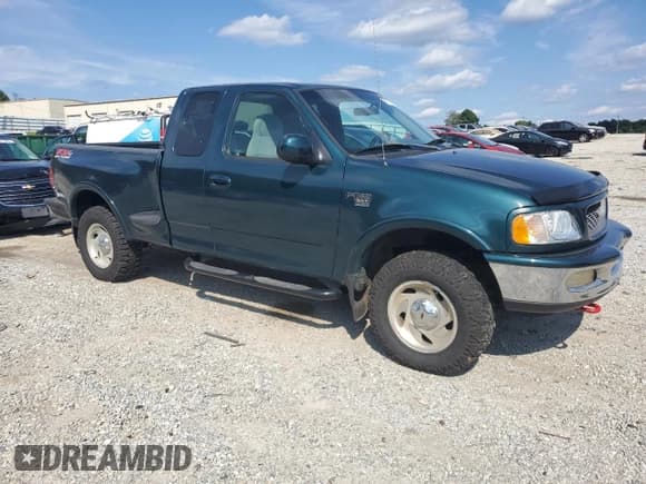 ✅ 1998 Ford F-150 XL • VIN: 1FTRX08L7WKB03365 • Lot: 71013335. Listed on Copart with 166,271 mi. Free auction sales archive from the USA and detailed vehicle history report at DreamBid. Image 4.
