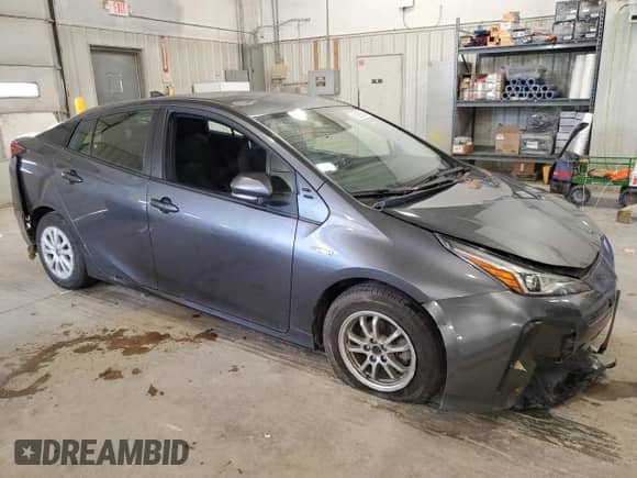 2021 Toyota Prius L Eco с VIN JTDKAMFU5M3143781, выставлен на аукционе Copart как лот 81028565 с пробегом 52 355 миль миль и Списание • Salvage title. История ставок и продаж доступна на DreamBid. Изображение 4.