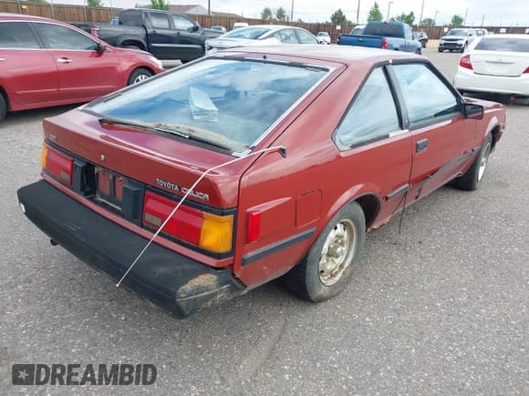 ✅ 1984 Toyota Celica • VIN: JT2RA64L8E0053797 • Lot: 42417519. Wystawiony na IAAI z przebiegiem 242 769 mil. Bezpłatny archiwum sprzedaży aukcyjnych z USA i szczegółowy raport historii pojazdu na DreamBid. Zdjęcie 4.