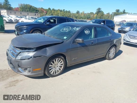 ✅ 2012 Ford Fusion Hybrid • VIN: 3FADP0L37CR221169 • Lot: 43415679. Listed on IAAI with 124,271 mi. Free auction sales archive from the USA and detailed vehicle history report at DreamBid. Image 2.