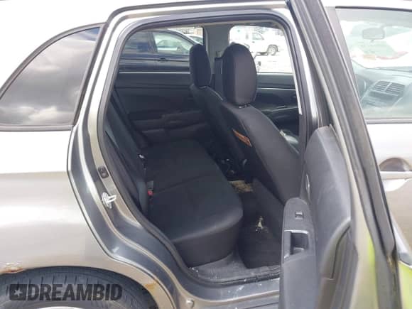 2013 Mitsubishi Outlander ES z VIN 4A4AP3AUXDE020860, wystawiony jako IAAI lot #43064158 z przebiegiem 162 134 mil mil oraz . Historia ofert i sprzedaży dostępna na DreamBid. Obrazek 8.