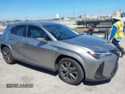 ✅ 2022 Lexus UX 200 F Sport • VIN: JTHE3JBH3N2056014 • Лот: 41832434. Опубликован ранее на IAAI с пробегом 25 693 миль. Бесплатный доступ к архиву аукционных продаж из США и подробный отчёт об истории автомобиля на DreamBid. Изображение 1.