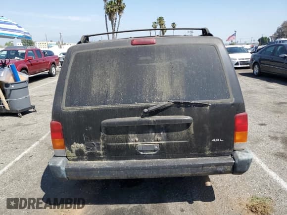 ✅ 1999 Jeep Cherokee Sport • VIN: 1J4FT68S0XL555883 • Lot: 51016255. Listed on Copart with 128,306 mi. Free auction sales archive from the USA and detailed vehicle history report at DreamBid. Image 6.