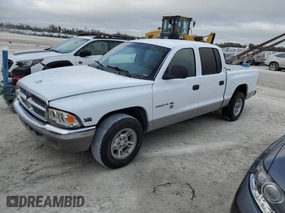 2000 Dodge Dakota Sport z VIN 1B7GL2AN5YS642063, wystawiony jako Copart lot #76665334 z przebiegiem Nie podano mil oraz Nie do naprawy • Non repairable. Historia ofert i sprzedaży dostępna na DreamBid. Obrazek 1.