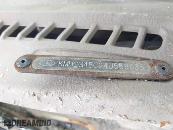 2004 Hyundai Accent GL z VIN KMHCG45C24U559935, wystawiony jako IAAI lot #40487927 z przebiegiem Nie podano mil oraz . Historia ofert i sprzedaży dostępna na DreamBid. Obrazek 12.