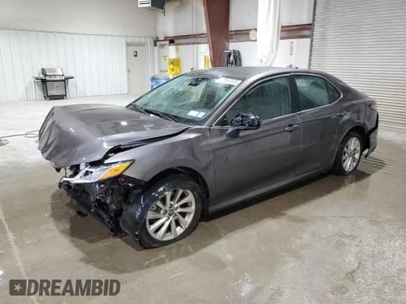 2023 Toyota Camry LE с VIN 4T1C11BK7PU097260, выставлен на аукционе Copart как лот 67957575 с пробегом 21 092 миль миль и Списание • Salvage title. История ставок и продаж доступна на DreamBid. Изображение 1.
