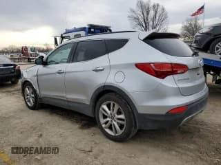 ✅ 2015 Hyundai Santa Fe • VIN: 5XYZWDLA6FG257314 • Лот: 39433434. Опубликован ранее на Copart с пробегом 76 956 миль. Бесплатный доступ к архиву аукционных продаж из США и подробный отчёт об истории автомобиля на DreamBid. Изображение 2.
