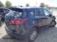 ✅ 2016 Mazda CX-5 Touring • VIN: JM3KE2CY7G0849891 • Lot: 43288504. Listed on IAAI with 133,906 mi. Free auction sales archive from the USA and detailed vehicle history report at DreamBid. Image 4.