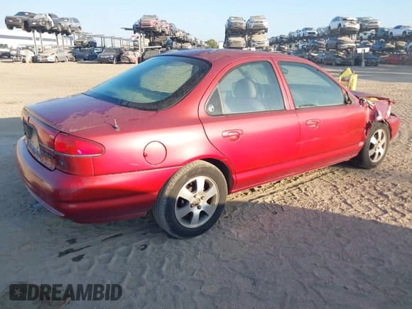 ✅ 1999 Mercury Mystique • VIN: 1MEFM66L8XK608607 • Lot: 43714271. Listed on IAAI with 65,518 mi. Free auction sales archive from the USA and detailed vehicle history report at DreamBid. Image 4.