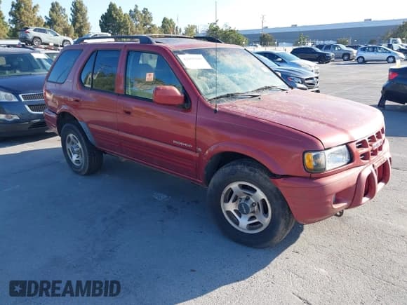 ✅ 2001 Isuzu Rodeo S • VIN: 4S2DM58W814303358 • Lot: 42695509. Listed on IAAI with Not provided. Free auction sales archive from the USA and detailed vehicle history report at DreamBid. Image 1.