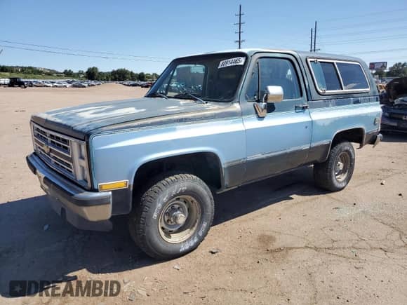 1987 Chevrolet Blazer z VIN 1GNEV18K7HF180306, wystawiony jako Copart lot #80914465 z przebiegiem 455 897 mil mil oraz Nie do naprawy • Non repairable. Historia ofert i sprzedaży dostępna na DreamBid. Obrazek 1.