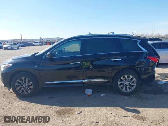 ✅ 2015 Infiniti QX60 • VIN: 5N1AL0MM7FC556043 • Lot: 41134765. Listed on IAAI with 144,311 mi. Free auction sales archive from the USA and detailed vehicle history report at DreamBid. Image 14.