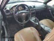 ✅ 2002 Mazda MX-5 Miata Cloth • VIN: JM1NB353X20221368 • Lot: 68927484. Wystawiony na Copart z przebiegiem 127 242 mil. Bezpłatny archiwum sprzedaży aukcyjnych z USA i szczegółowy raport historii pojazdu na DreamBid. Zdjęcie 8.