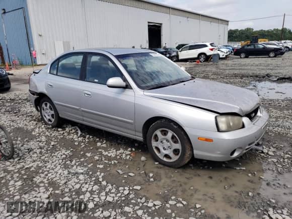 2003 Hyundai Elantra GLS with VIN KMHDN45D73U625235, listed as a Copart auction lot 62965683 with 153,845 mi miles and Salvage title. Bid and sale history available at DreamBid. Image 4.