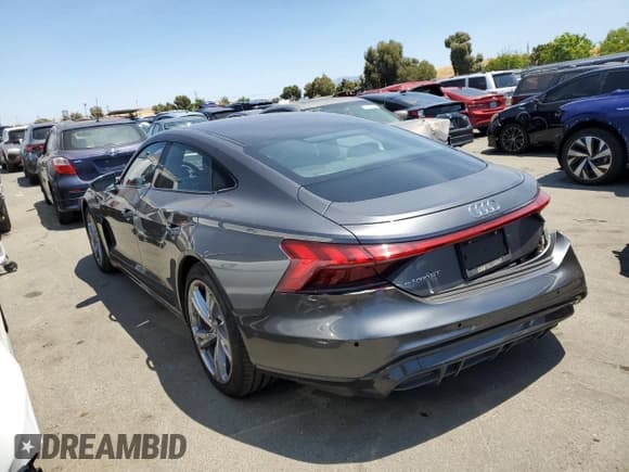 ✅ 2022 Audi e-tron GT Prestige • VIN: WAUDJBFW9N7004503 • Лот: 57742104. Опубликован ранее на Copart с пробегом 27 457 миль. Бесплатный доступ к архиву аукционных продаж из США и подробный отчёт об истории автомобиля на DreamBid. Изображение 2.