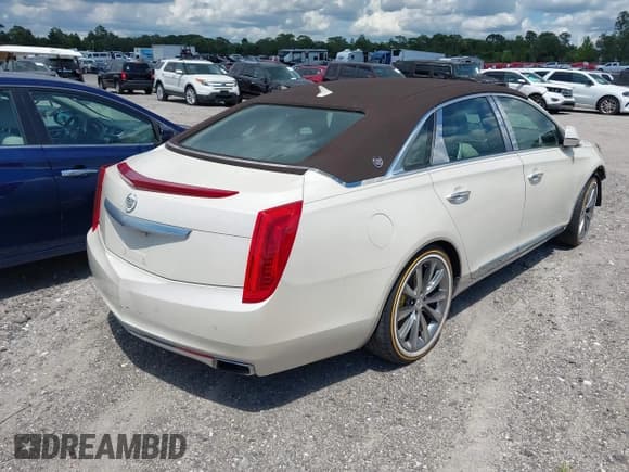✅ 2013 Cadillac XTS Luxury • VIN: 2G61P5S34D9191733 • Lot: 42318119. Listed on IAAI with 129,379 mi. Free auction sales archive from the USA and detailed vehicle history report at DreamBid. Image 4.