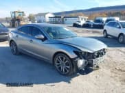 ✅ 2015 Mazda 6 i Grand Touring • VIN: JM1GJ1W56F1213509 • Lot: 43609197. Listed on IAAI with 96,094 mi. Free auction sales archive from the USA and detailed vehicle history report at DreamBid. Image 1.