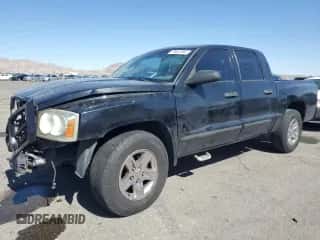 2006 Dodge Dakota SLT z VIN 1D7HE48N76S688934, wystawiony jako Copart lot #75057094 z przebiegiem 235 087 mil mil oraz Szkoda całkowita • Salvage title. Historia ofert i sprzedaży dostępna na DreamBid. Obrazek 1.