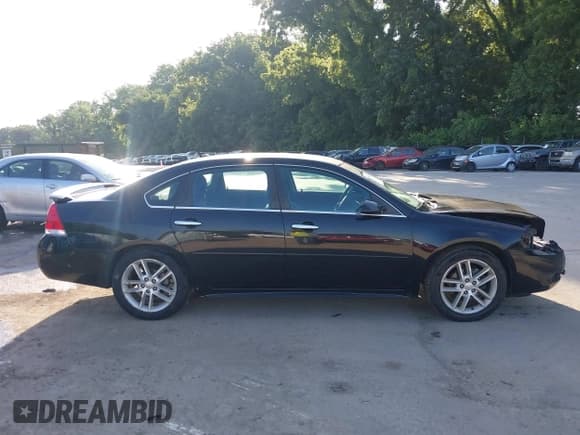✅ 2014 Chevrolet Impala LTZ • VIN: 2G1WC5E34E1121782 • Lot: 42543786. Listed on IAAI with 111,767 mi. Free auction sales archive from the USA and detailed vehicle history report at DreamBid. Image 14.