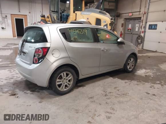 2013 Chevrolet Sonic LT with VIN 1G1JD6SH7D4203621, listed as a IAAI auction lot 41546319 with 201,164 mi miles and . Bid and sale history available at DreamBid. Image 4.