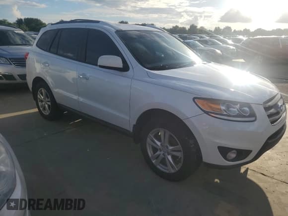 ✅ 2012 Hyundai Santa Fe Limited • VIN: 5XYZK4AG0CG104670 • Lot: 74339274. Listed on Copart with 69,102 mi. Free auction sales archive from the USA and detailed vehicle history report at DreamBid. Image 4.