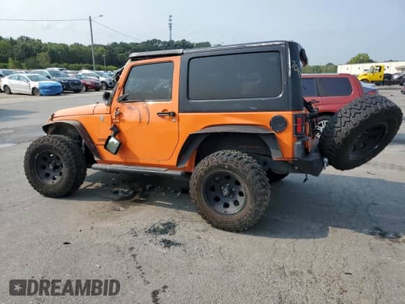 2012 Jeep Wrangler Sport z VIN 1C4AJWAGXCL187041, wystawiony jako Copart lot #71404335 z przebiegiem 127 412 mil mil oraz Szkoda całkowita • Salvage title. Historia ofert i sprzedaży dostępna na DreamBid. Obrazek 2.
