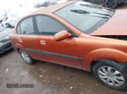 ✅ 2009 Kia Rio LX • VIN: KNADE223596580617 • Lot: 43727560. Wystawiony na IAAI z przebiegiem 243 386 mil. Bezpłatny archiwum sprzedaży aukcyjnych z USA i szczegółowy raport historii pojazdu na DreamBid. Zdjęcie 12.