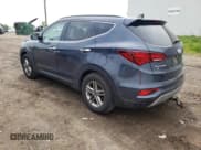 ✅ 2017 Hyundai Santa Fe 2.4L • VIN: 5NMZUDLB2HH028684 • Лот: 54316714. Опубликован ранее на Copart с пробегом 86 222 миль. Бесплатный доступ к архиву аукционных продаж из США и подробный отчёт об истории автомобиля на DreamBid. Изображение 2.