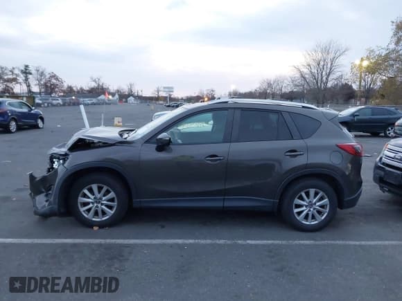 ✅ 2016 Mazda CX-5 Touring • VIN: JM3KE4CY5G0845575 • Lot: 43653030. Listed on IAAI with 79,795 mi. Free auction sales archive from the USA and detailed vehicle history report at DreamBid. Image 14.