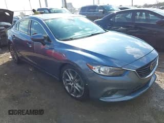 ✅ 2014 Mazda 6 i Grand Touring • VIN: JM1GJ1W69E1125786 • Lot: 43601262. Listed on IAAI with 286,089 mi. Free auction sales archive from the USA and detailed vehicle history report at DreamBid. Image 1.