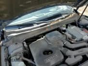 ✅ 2018 Lincoln MKZ Hybrid Reserve • VIN: 3LN6L5MU9JR614831 • Лот: 59529095. Опубликован ранее на Copart с пробегом 88 554 миль. Бесплатный доступ к архиву аукционных продаж из США и подробный отчёт об истории автомобиля на DreamBid. Изображение 13.