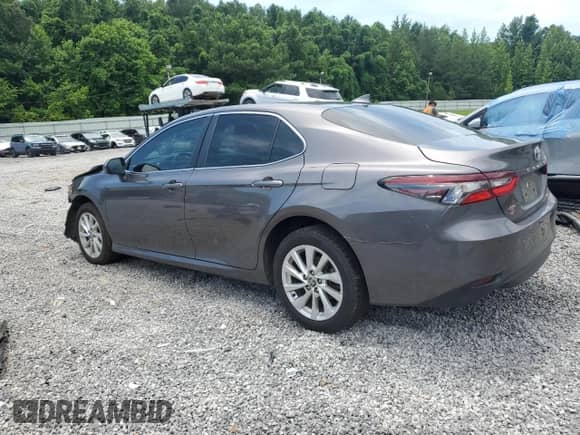 2023 Toyota Camry LE с VIN 4T1C11BK1PU102890, выставлен на аукционе Copart как лот 62864095 с пробегом 67 528 миль миль и Списание • Salvage title. История ставок и продаж доступна на DreamBid. Изображение 2.