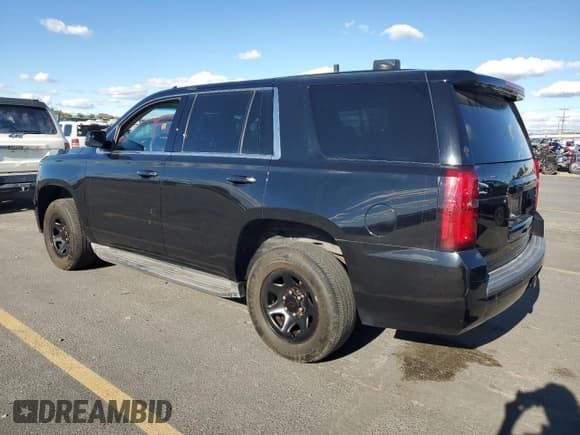 ✅ 2015 Chevrolet Tahoe Commercial • VIN: 1GNLC2EC3FR575336 • Lot: 90258435. Listed on Copart with 148,079 mi. Free auction sales archive from the USA and detailed vehicle history report at DreamBid. Image 2.