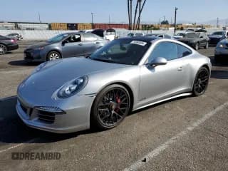 ✅ 2015 Porsche 911 Carrera S • VIN: WP0AB2A90FS125469 • Lot: 74260934. Listed on Copart with 62,302 mi. Free auction sales archive from the USA and detailed vehicle history report at DreamBid. Image 1.